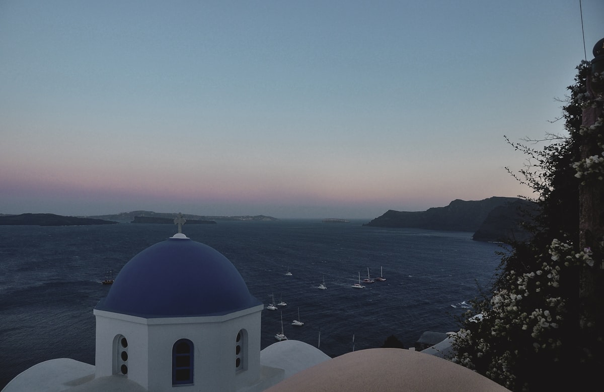 Blue domed church overlooking the sea in Santorini
