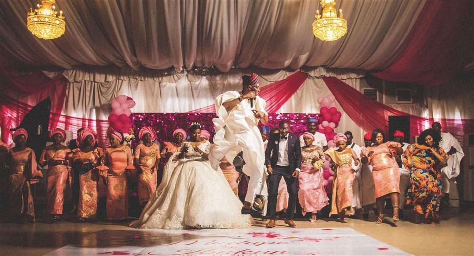 Bride and groom's jubilant entrance onto the reception dance floor