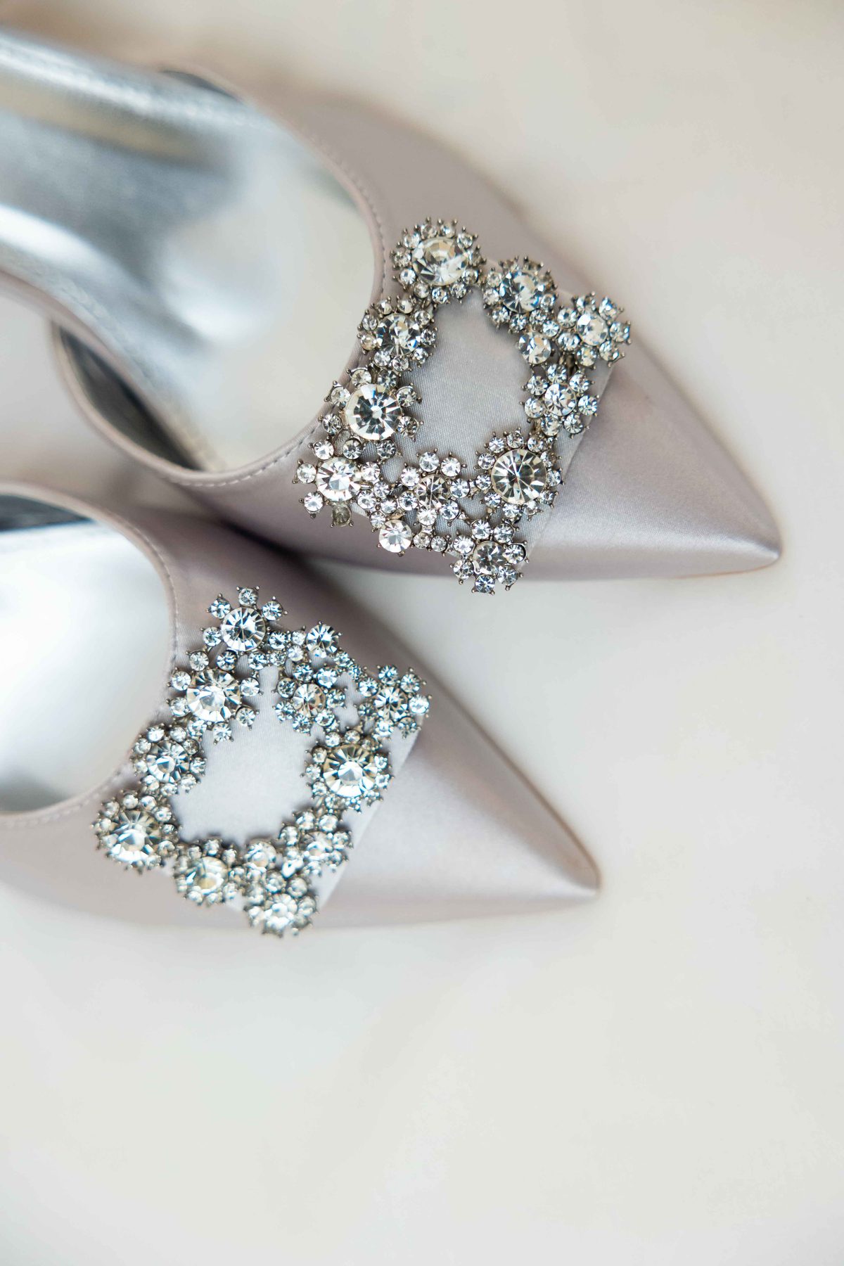 Elegant silver bridal shoes with crystal buckle detail